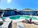 Inviting kidney-shaped pool with patio and lounge chairs at 1424 Breaks Way, Port Orange, FL 32127