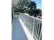 White deck with white railings overlooking the neighborhood at 15 Richmond Dr, New Smyrna Beach, FL 32169