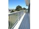 White deck with white railings and neighborhood view at 15 Richmond Dr, New Smyrna Beach, FL 32169