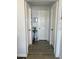 Clean and bright hallway with neutral color palette at 15 Richmond Dr, New Smyrna Beach, FL 32169