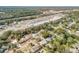 Wide aerial view showing home and local businesses at 1506 Palmetto St, New Smyrna Beach, FL 32168