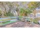 Deck with wooden benches, offering a relaxing outdoor space at 1506 Palmetto St, New Smyrna Beach, FL 32168