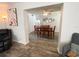 View of the dining room from living room, featuring wood table and floors at 1506 Palmetto St, New Smyrna Beach, FL 32168