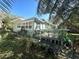 Green house with deck and mature landscaping at 1506 Palmetto St, New Smyrna Beach, FL 32168