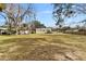 Spacious backyard with mature trees at 1596 Elizabeth St, New Smyrna Beach, FL 32168