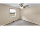 Simple bedroom with carpet and ceiling fan at 1596 Elizabeth St, New Smyrna Beach, FL 32168