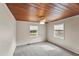 Bedroom with wood ceiling and two windows at 1596 Elizabeth St, New Smyrna Beach, FL 32168