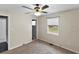 Bright bedroom with ceiling fan and window at 1596 Elizabeth St, New Smyrna Beach, FL 32168