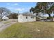 Single story home with a long driveway and fenced yard at 1596 Elizabeth St, New Smyrna Beach, FL 32168