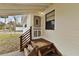 Front door with a screen door and wooden steps at 1596 Elizabeth St, New Smyrna Beach, FL 32168