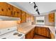 Kitchen with wood cabinets and stainless steel appliances at 1596 Elizabeth St, New Smyrna Beach, FL 32168