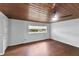 Living room with wood floors and ceiling at 1596 Elizabeth St, New Smyrna Beach, FL 32168