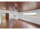 Living room with wood ceiling and hardwood floors at 1596 Elizabeth St, New Smyrna Beach, FL 32168