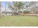 Private backyard with fenced-in area and lush lawn at 1622 Pine Tree Dr, Edgewater, FL 32132