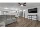 Open concept living area with kitchen and hardwood floors at 1622 Pine Tree Dr, Edgewater, FL 32132