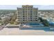 Aerial view of beachfront building with pool and beach access at 1705 S Atlantic Ave # 302, New Smyrna Beach, FL 32169