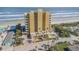 Aerial view of beachfront building and surrounding neighborhood at 1705 S Atlantic Ave # 302, New Smyrna Beach, FL 32169