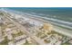 Aerial view showcasing building's beachfront location and surroundings at 1705 S Atlantic Ave # 302, New Smyrna Beach, FL 32169