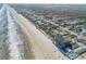 Wide aerial view of coastline, highlighting building's location at 1705 S Atlantic Ave # 302, New Smyrna Beach, FL 32169