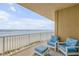 Oceanfront balcony with seating, offering stunning beach views at 1705 S Atlantic Ave # 302, New Smyrna Beach, FL 32169