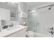 Bathroom with shower/tub, vanity, and white cabinets at 1705 S Atlantic Ave # 302, New Smyrna Beach, FL 32169