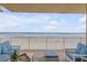 Spacious balcony overlooking the ocean with comfortable seating at 1705 S Atlantic Ave # 302, New Smyrna Beach, FL 32169