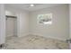 Well-lit bedroom with ceiling fan and closet at 1852 Sabal Palm Dr, Edgewater, FL 32141