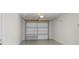 Garage with storage and overhead door at 1852 Sabal Palm Dr, Edgewater, FL 32141