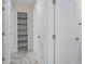 Clean hallway with storage and tile flooring at 1852 Sabal Palm Dr, Edgewater, FL 32141