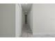 Bright hallway with tile floors and storage closet at 1852 Sabal Palm Dr, Edgewater, FL 32141