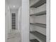 Hallway with built-in storage and tile floors at 1852 Sabal Palm Dr, Edgewater, FL 32141