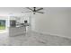 Open living room and kitchen with modern flooring and ceiling fan at 1852 Sabal Palm Dr, Edgewater, FL 32141