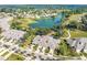 Aerial view of house and surrounding golf course community at 1938 Turnbull Lakes Dr, New Smyrna Beach, FL 32168