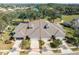 Aerial view showcasing three-unit townhome building at 1938 Turnbull Lakes Dr, New Smyrna Beach, FL 32168