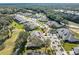 Aerial view of house and surrounding golf course community at 1938 Turnbull Lakes Dr, New Smyrna Beach, FL 32168