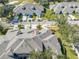 Aerial view of house and surrounding golf course community at 1938 Turnbull Lakes Dr, New Smyrna Beach, FL 32168