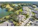 Aerial view of house and surrounding golf course community at 1938 Turnbull Lakes Dr, New Smyrna Beach, FL 32168