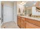 Bathroom with double vanity, granite countertops and shower at 1938 Turnbull Lakes Dr, New Smyrna Beach, FL 32168