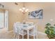 Charming dining room with white table and chairs at 1938 Turnbull Lakes Dr, New Smyrna Beach, FL 32168