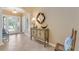 Bright entryway with decorative console table and mirror at 1938 Turnbull Lakes Dr, New Smyrna Beach, FL 32168