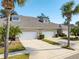 Exterior view of a charming three-unit townhome building at 1938 Turnbull Lakes Dr, New Smyrna Beach, FL 32168