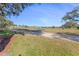 Scenic view of a golf course with homes in the background at 1938 Turnbull Lakes Dr, New Smyrna Beach, FL 32168