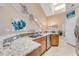 Kitchen features granite countertops and a double sink at 1938 Turnbull Lakes Dr, New Smyrna Beach, FL 32168