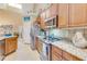 Kitchen with granite countertops and stainless steel range at 1938 Turnbull Lakes Dr, New Smyrna Beach, FL 32168