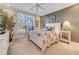 Spacious main bedroom with a king-size bed and large window at 1938 Turnbull Lakes Dr, New Smyrna Beach, FL 32168