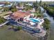 Bird's-eye view of home, pool, and private dock on the waterfront at 2 Richmond Dr, New Smyrna Beach, FL 32169