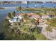 Aerial view of waterfront home with pool and private dock access at 2 Richmond Dr, New Smyrna Beach, FL 32169