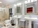 Elegant bathroom with dual vanities and a walk-in shower at 2 Richmond Dr, New Smyrna Beach, FL 32169