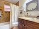 Bathroom with granite countertop and decorative mirror at 2 Richmond Dr, New Smyrna Beach, FL 32169