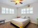 Light bedroom with a yellow platform bed and window shutters at 2 Richmond Dr, New Smyrna Beach, FL 32169